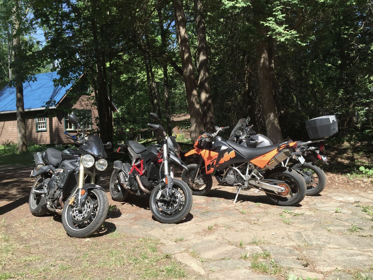 The perfect parking lot: Ducati Hypermotard, Triumph Street Triple, KTM 950 SM and a Triumph Explorer 1200