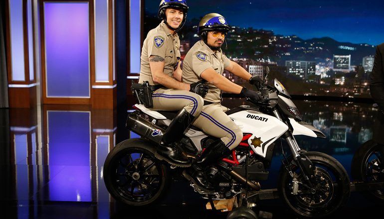 Chip stars Dax Shepard and Michael Pena posing on the HyperMotard