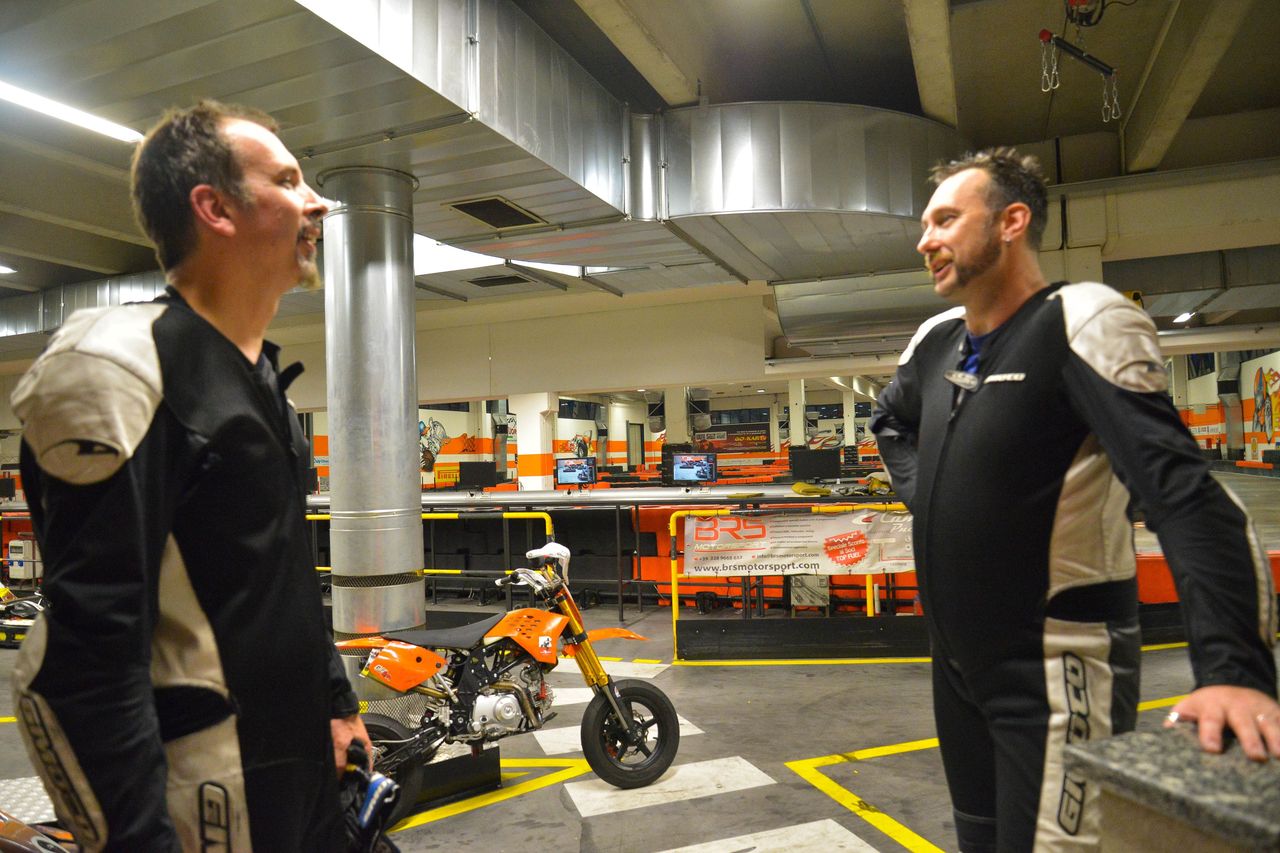Alex and Derreck talking about motorcycles at TopFuel