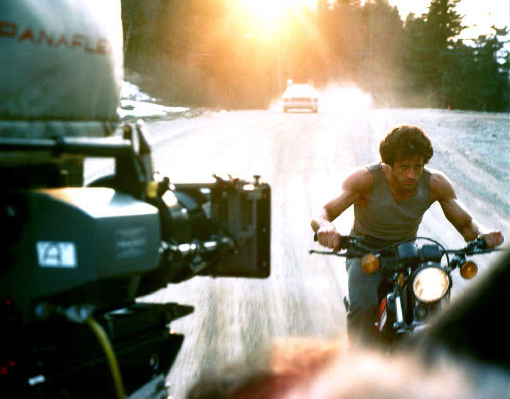 Sylvester Stallone filming the motorcycle chase scene for First Blood