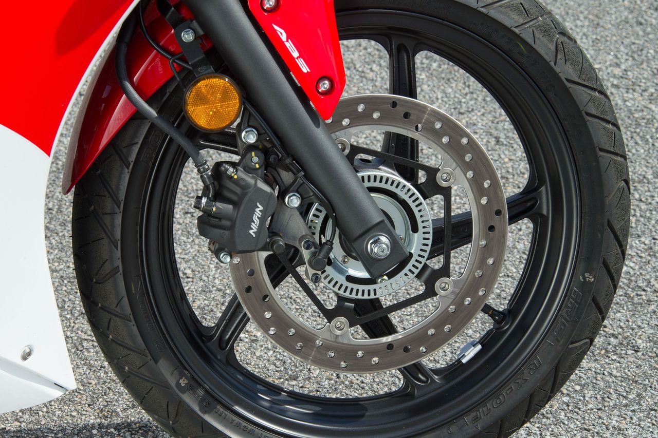 Honda’s twin-pot front brakes are more than enough for the CBR300R, even on the racetrack.
