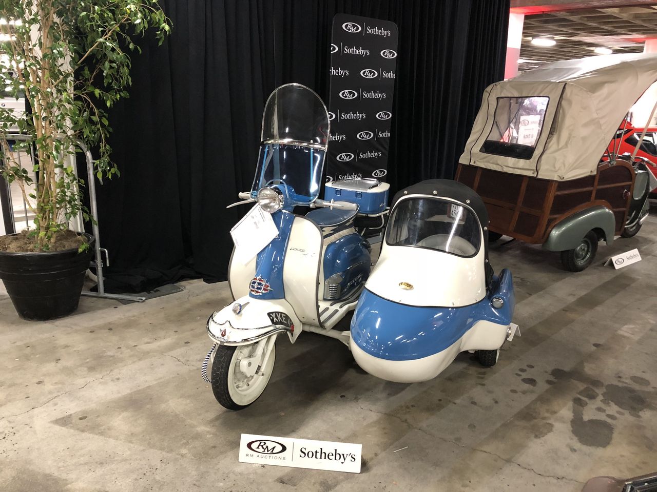 This 1961 example features a rare side car