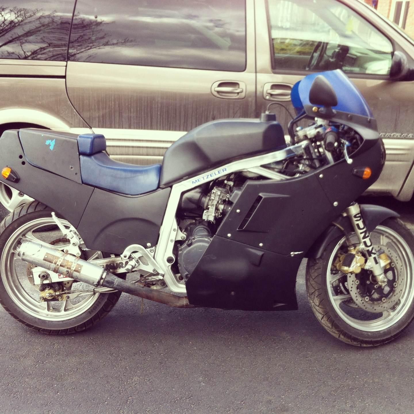 GSXR before i cleaner her all up ( Note the rediculous muffler set-up )