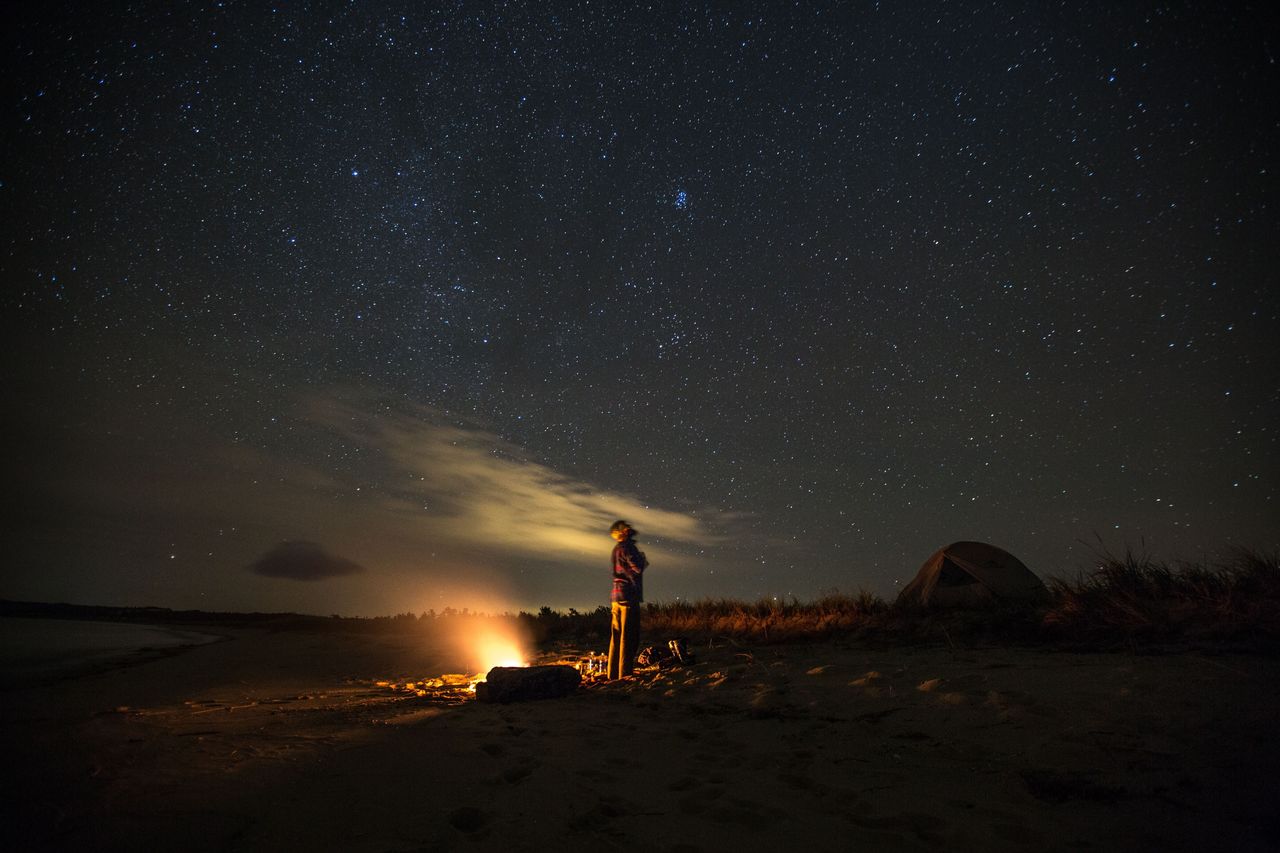 James T under a starry Michigan sky by Spencer Millsap for EatSleepRIDE