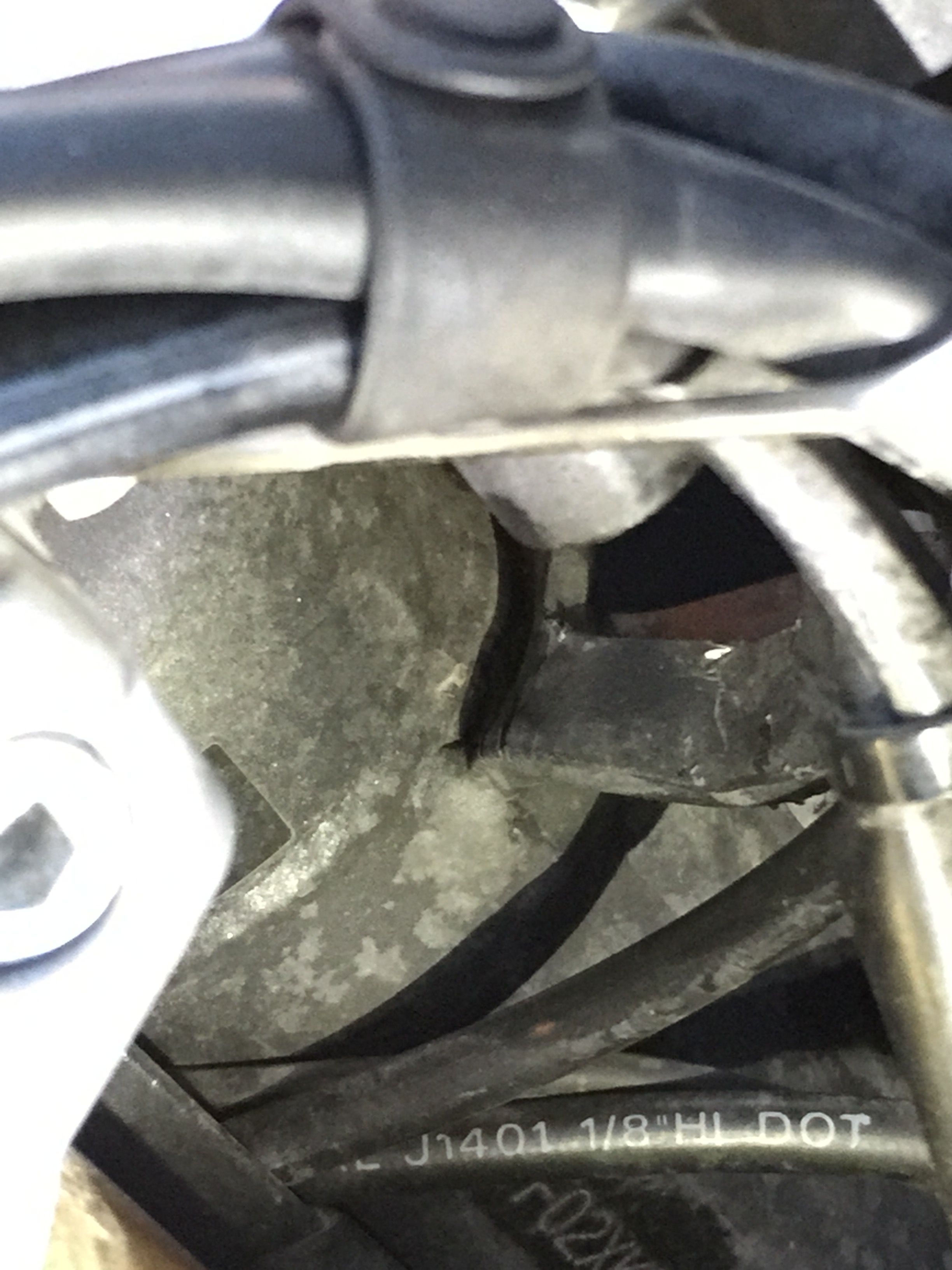 Cracked mystery bracket on the steering column of my Triumph Tiger 1200