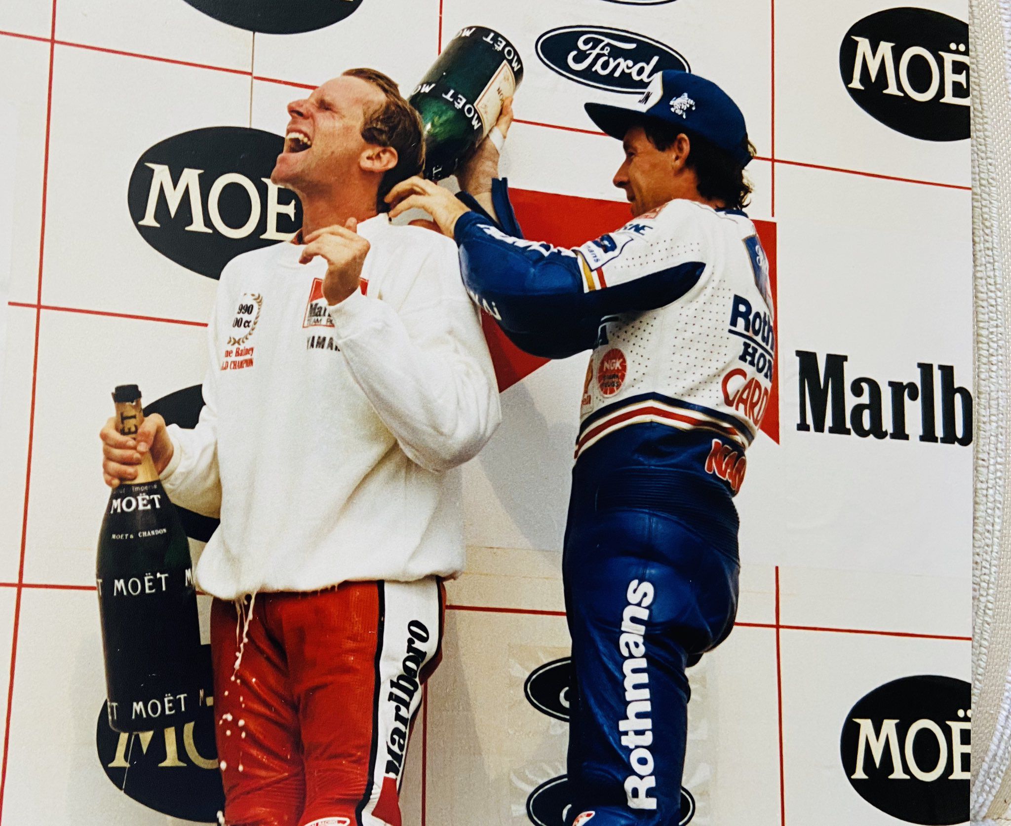 Wayne Rainey, left, celebrates his 1990 championship with some help from Wayne Gardner. 