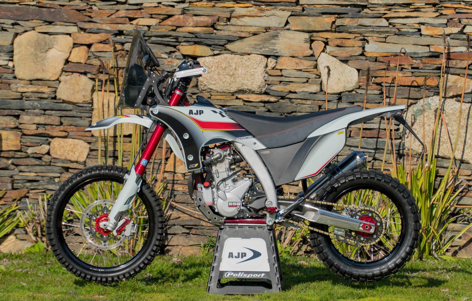 The bike's seat gives its rider plenty of room to move and slide around while wrestling the thumper through the dirt